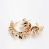A Rhodium plating floral statement ring adorned with small pearls, showcasing an elegant and modern design on a white background.