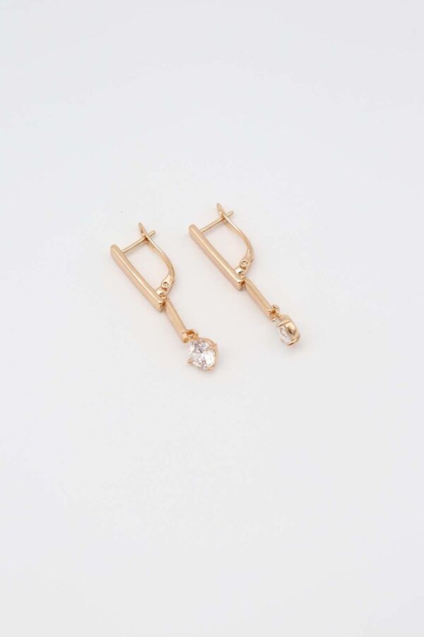 Rhodium plated dangle earrings with a sleek bar design and sparkling crystal pendants, displayed on a plain white background.
