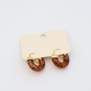 Amber Swirl Hoop Earrings with marbled amber-toned resin hoops and polished gold-plated accents from the Laleli Celestial Collection.