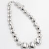 Lustrous Silver Bead Necklace with large polished silver-tone beads and adjustable lobster clasp.