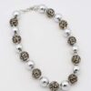 Leopard Print and Silver Bead Necklace with alternating silver-tone and leopard-print beads.