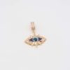 Gold evil eye pendant with blue enamel detailing and a radiant design