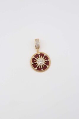 Gold round pendant with red enamel and star detailing