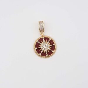 Gold round pendant with red enamel and star detailing