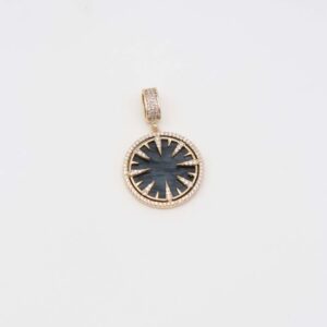 Gold celestial sun pendant with green gemstone center