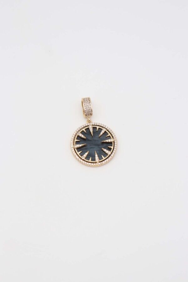Gold celestial sun pendant with green gemstone center