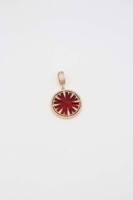 Gold twilight star pendant with deep red enamel
