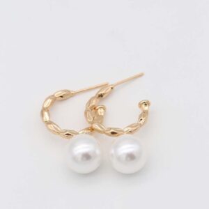 Gold textured hoop earrings with pearl accent