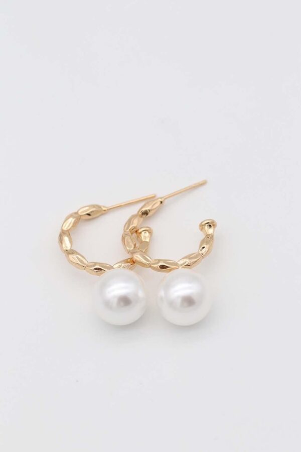 Gold textured hoop earrings with pearl accent