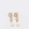 Elegant pearl drop earrings with gold and crystal details