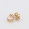 Gold crown-inspired hoop earrings with intricate details