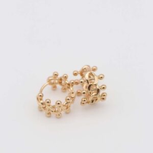 Gold crown-inspired hoop earrings with intricate details