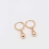 Gold teardrop hoop earrings with a smooth polished finish