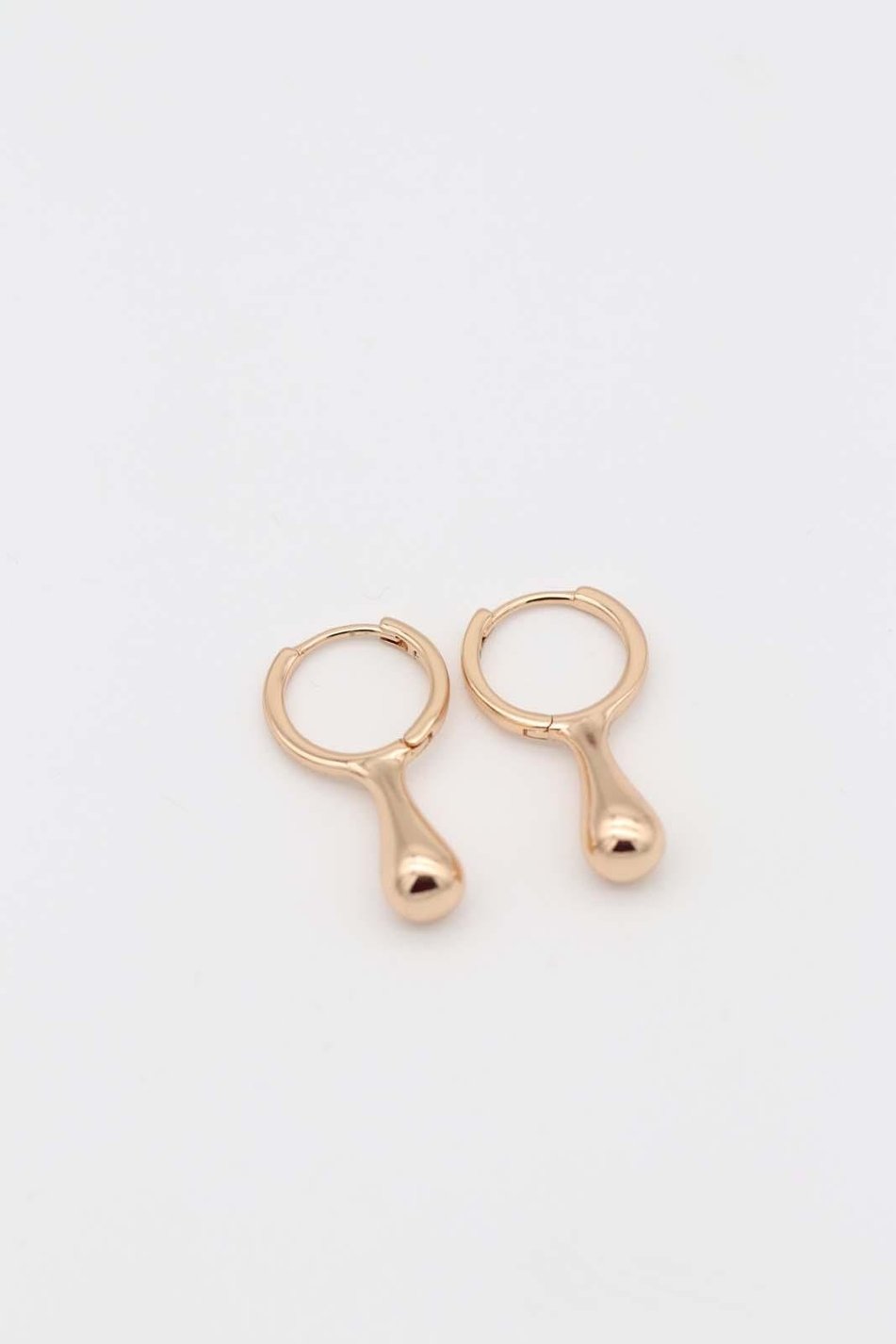 Gold teardrop hoop earrings with a smooth polished finish