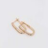 Gold hoop earrings with a crystal bar design