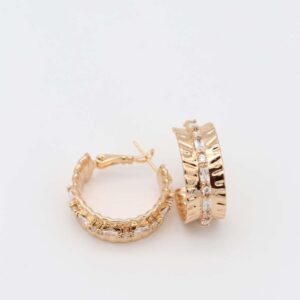 Wide gold hoop earrings with intricate details