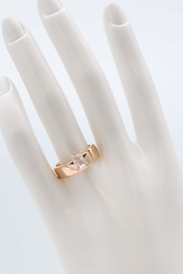 Princess cut gold band ring with a square gemstone